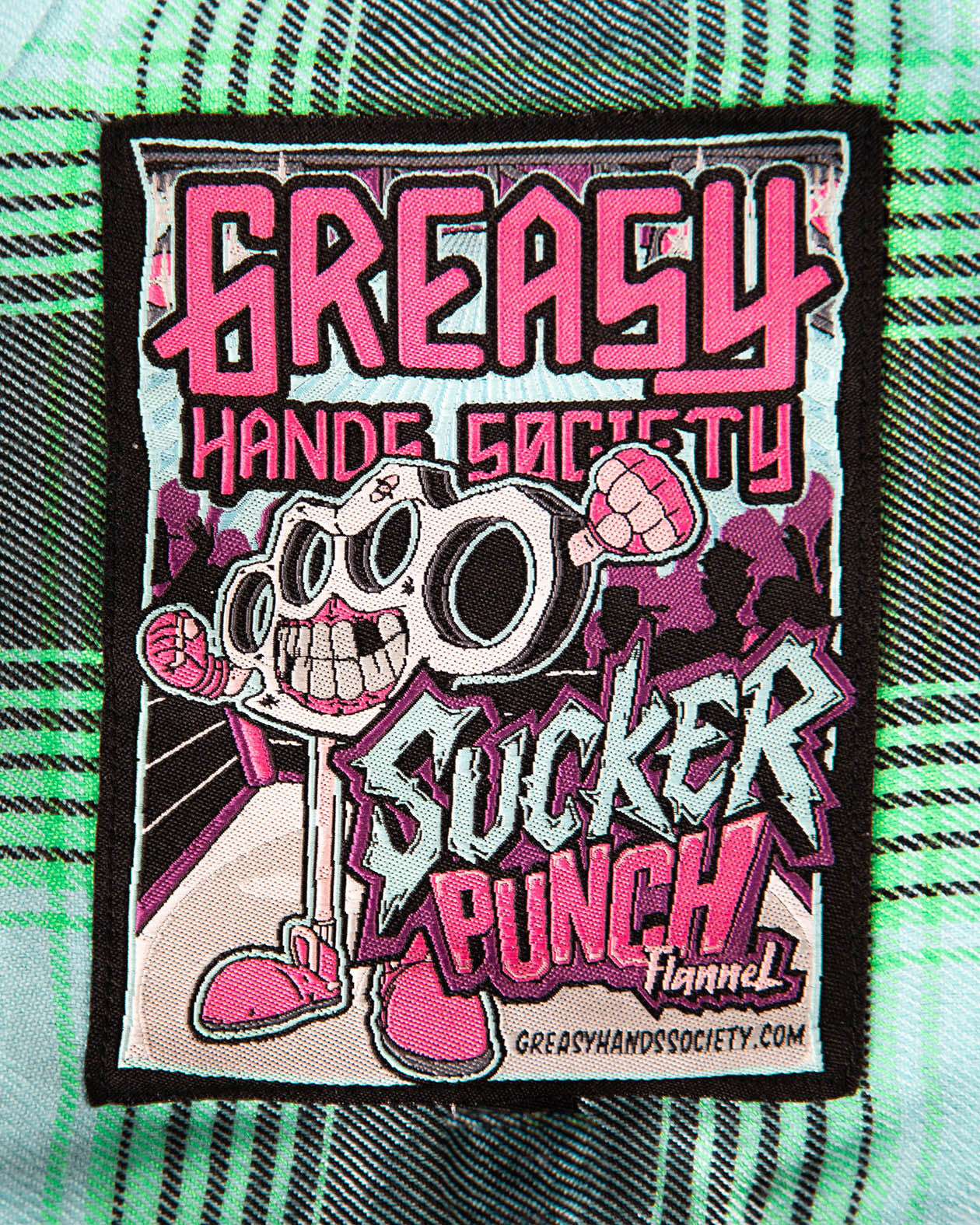 sucker punch blue and green lightweight flannel tag showing the name of the flannel