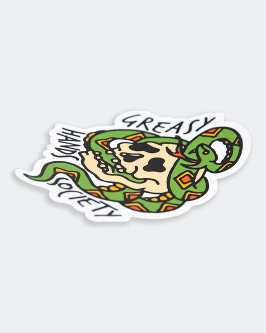 graphic sticker of a skull and snake on a gray background