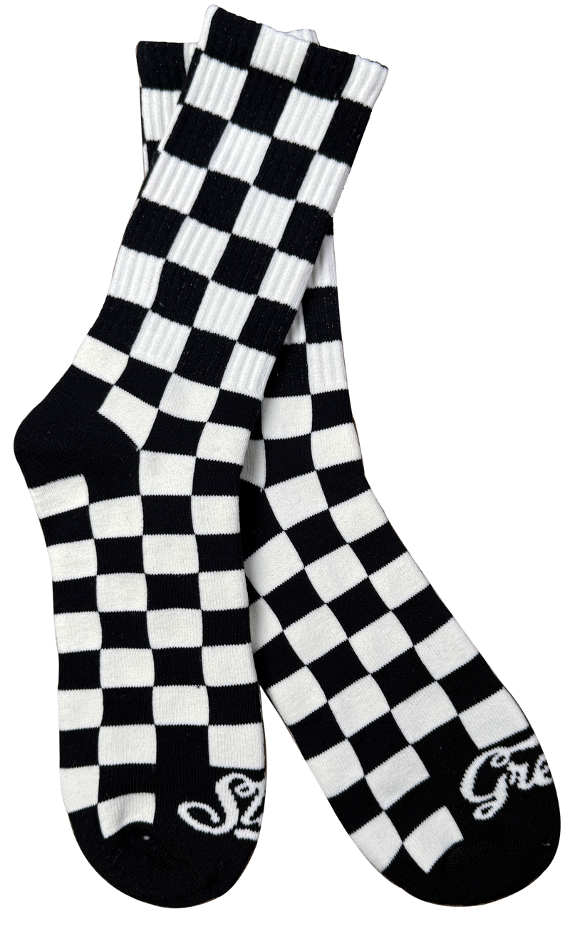 Black and white checkered socks with 'Greasy' branding on a white background