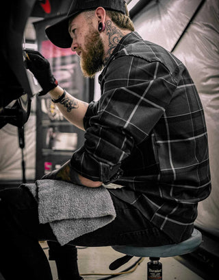 dapper flannel on a tattoo artist - gray and black flannel