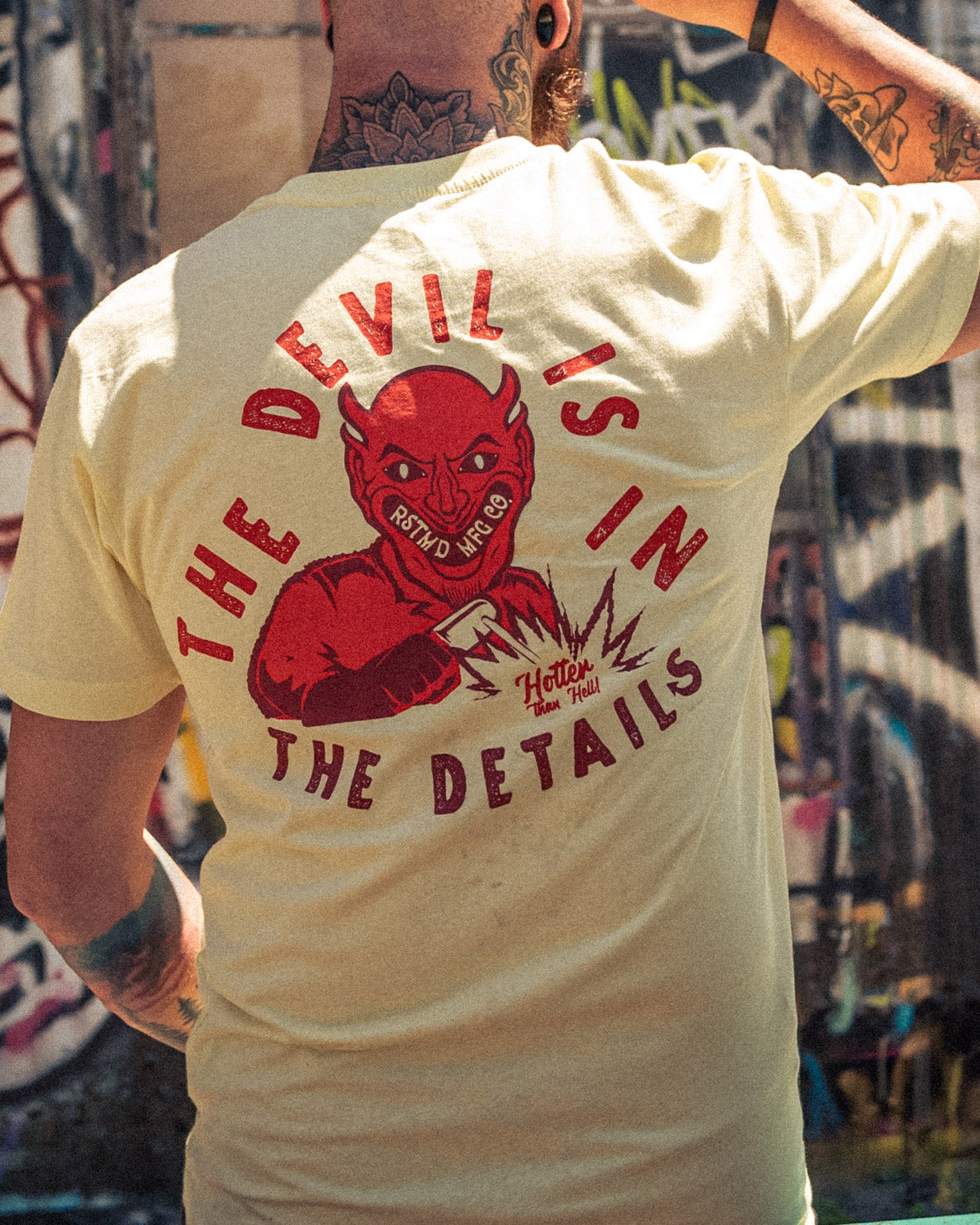 devil is in the details yellow t-shirt full back graphic of a devil