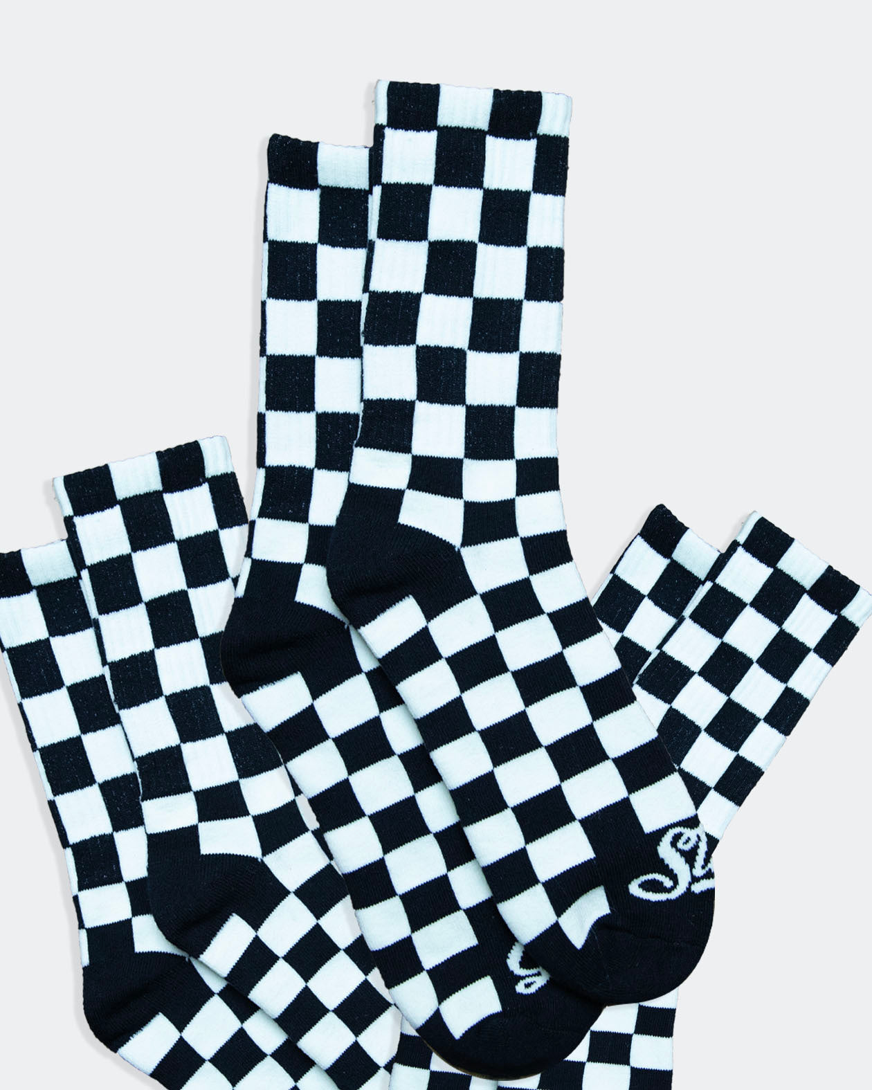 3-pack of black and white checkered crew socks from greasy hands society