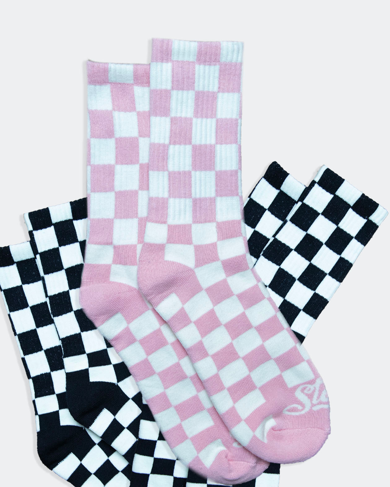 3-pack of black and white and pink and white checkered crew socks from greasy hands society