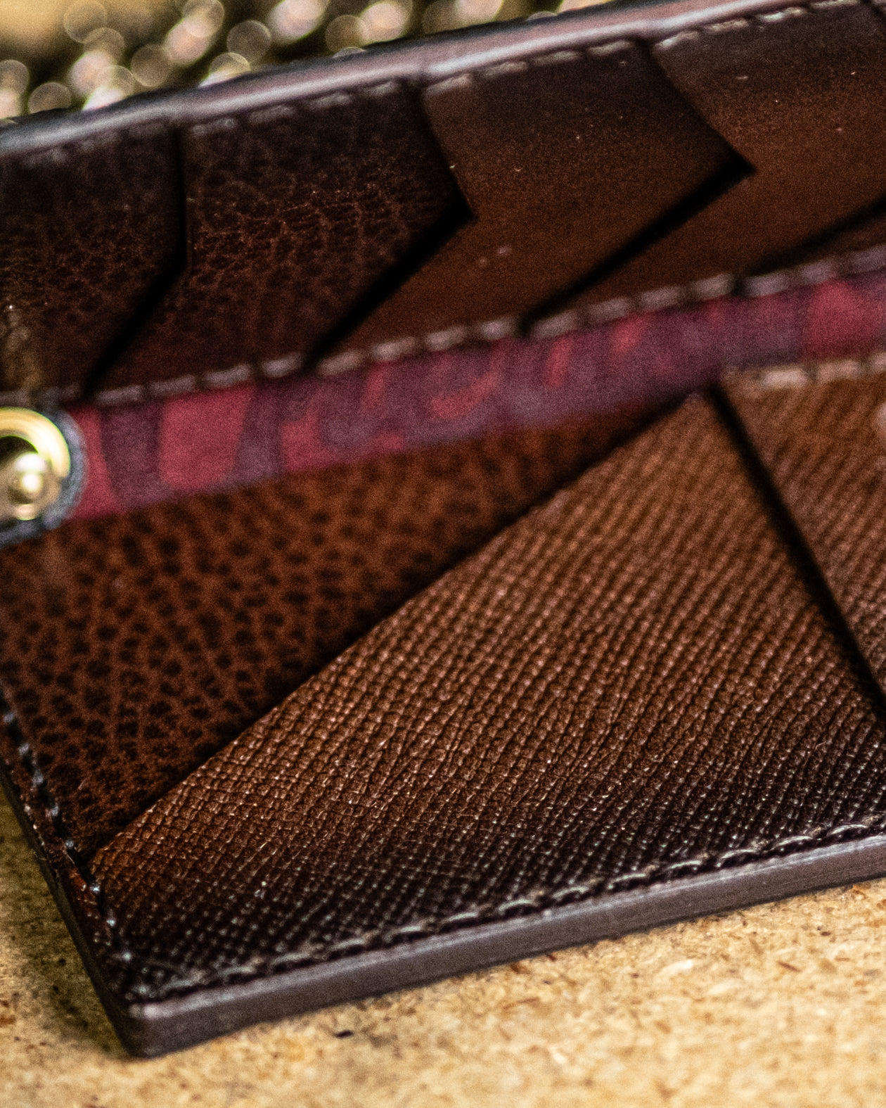Close-up of a brown leather wallet with textured surface - Brown leather wallet by Greasy Hands Society