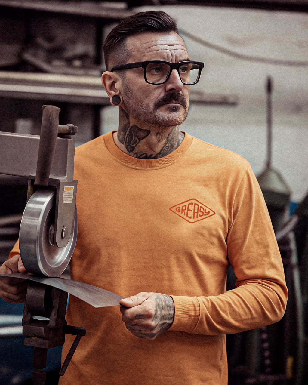 cross the line vintage orange long sleeved t-shirt with greasy in a diamond on the left chest