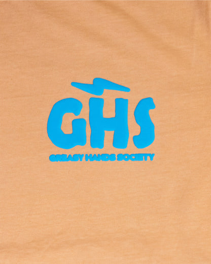 Blue 'GHS' logo on a orange graphic tee for women