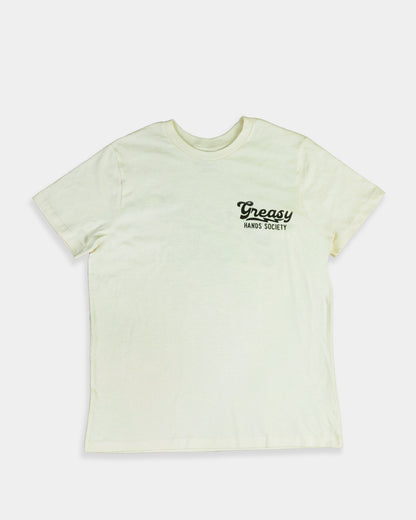 Light green destination graphic t-shirt with 'Greasy' logo on a white background 