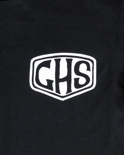 factory sealed women's Black t-shirt with a white ghs shield logo on a black background close up on the shied