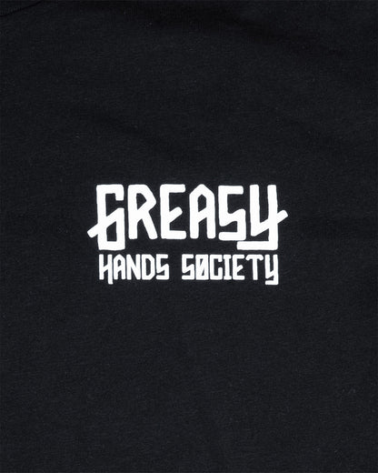 women's Black t-shirt with 'Greasy Hands Society' logo on the left chest text in white on a black background
