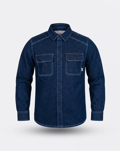Blue indigo denim shirt on a light gray background - The Wanderer Denim Shirt by Greasy Hands Society