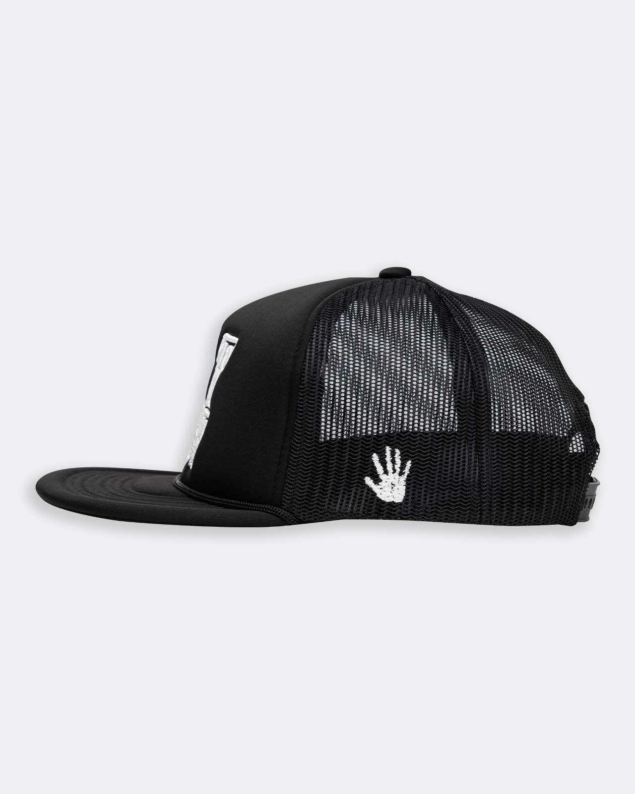 eat dust white text on black trucker hat side view