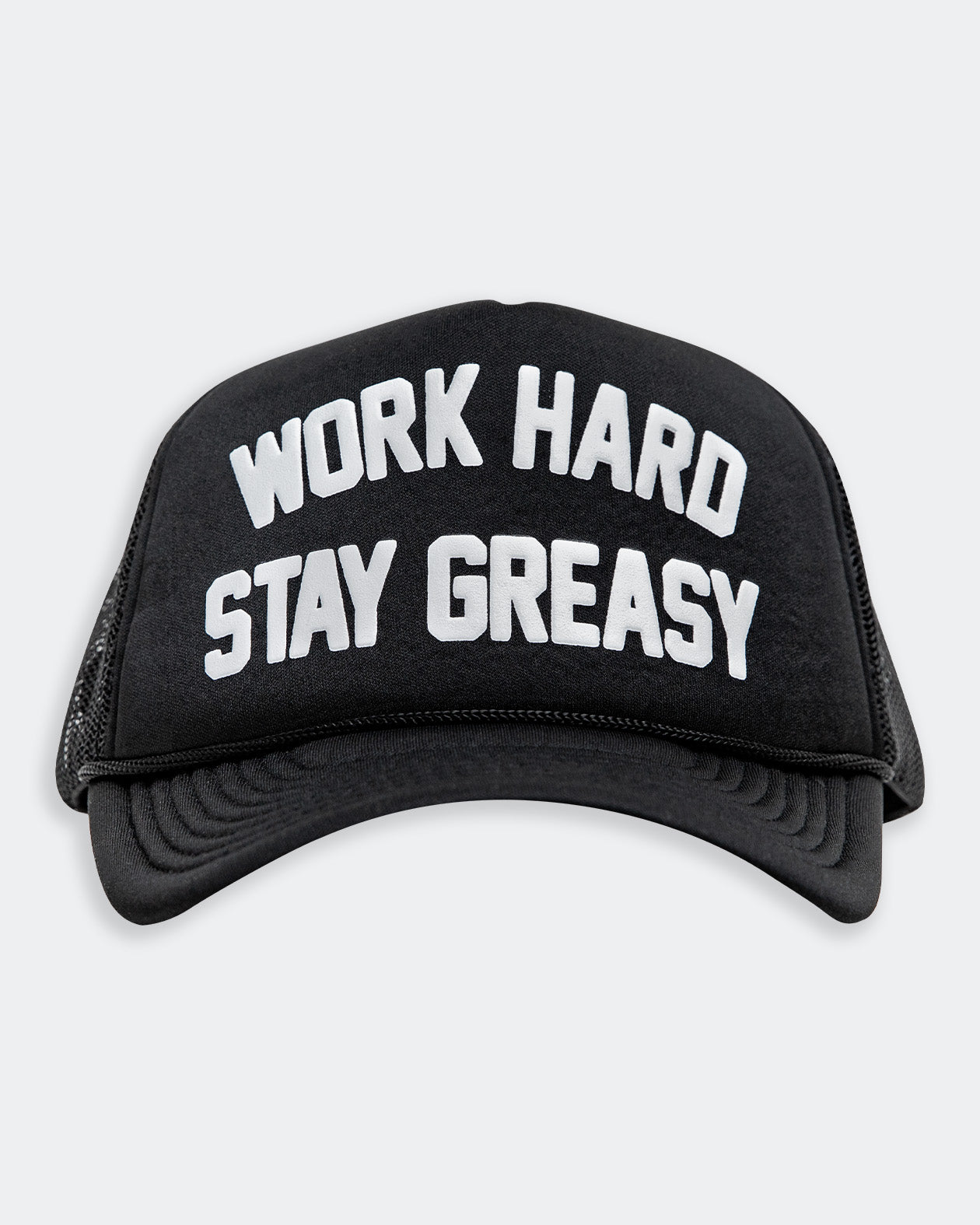 work hard stay greasy black  foam trucker hat with white text front view on gray background