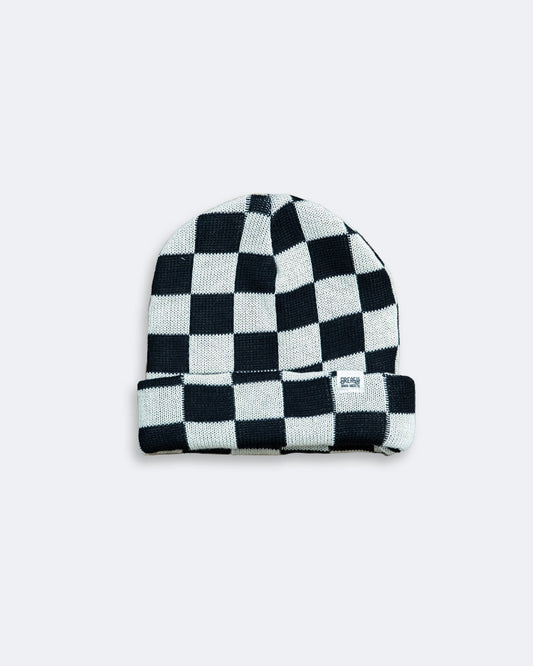 Black and white checkered beanie on a light gray background