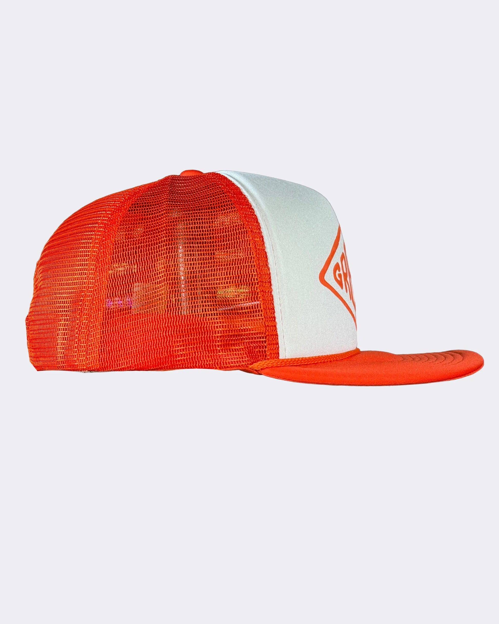 A trucker-style baseball cap with a white front panel and bright orange mesh back and visor, featuring a partial orange diamond logo on the front - Cross the Line Orange/White Hat by Greasy Hands Society