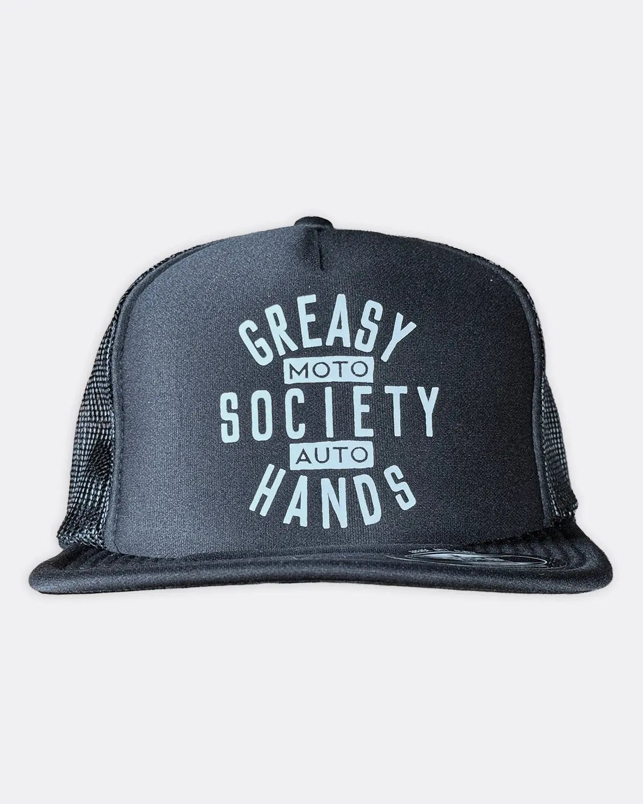 A black trucker hat with a white graphic print reading 'Greasy Hands Society - Moto - Auto' on the front panel, set against a light gray background - Black Station Hat by Greasy Hands Society