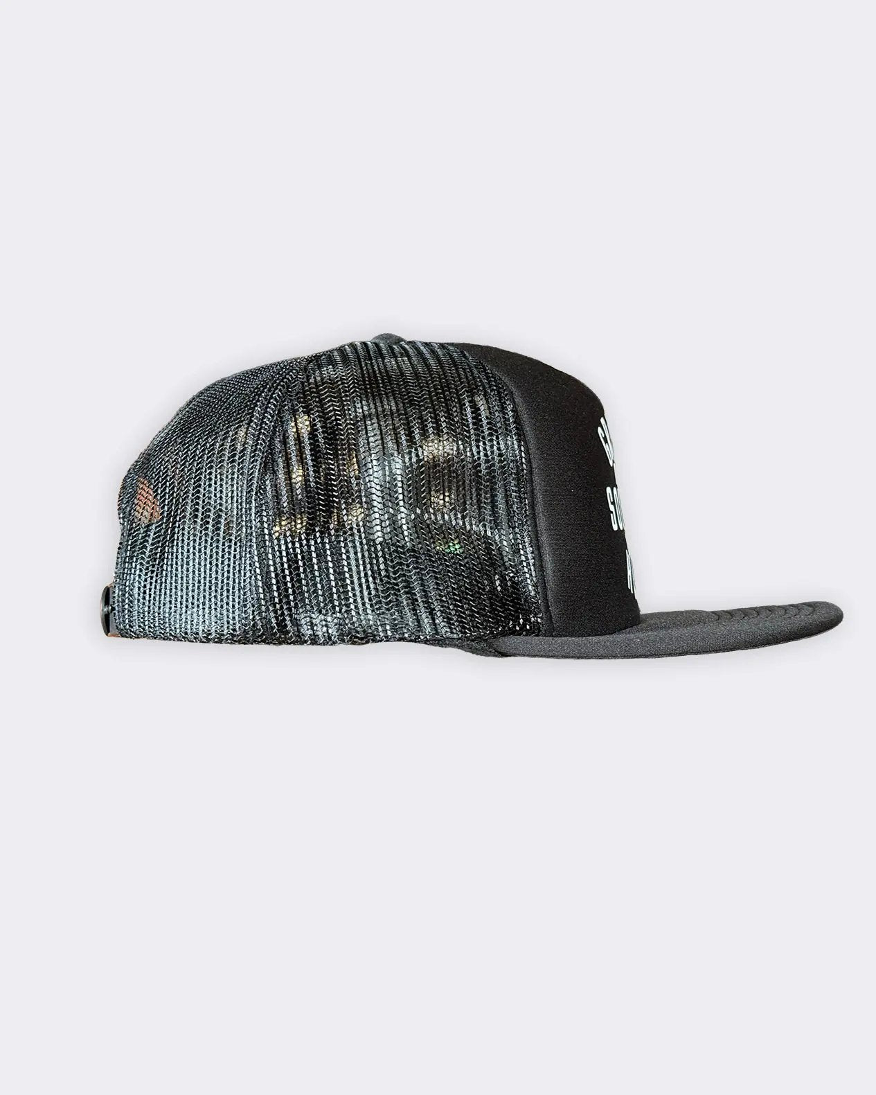 A black trucker hat with a black front panel and brim, featuring a black and black mesh back, and a small white graphic on the side - Black Station Hat by Greasy Hands Society