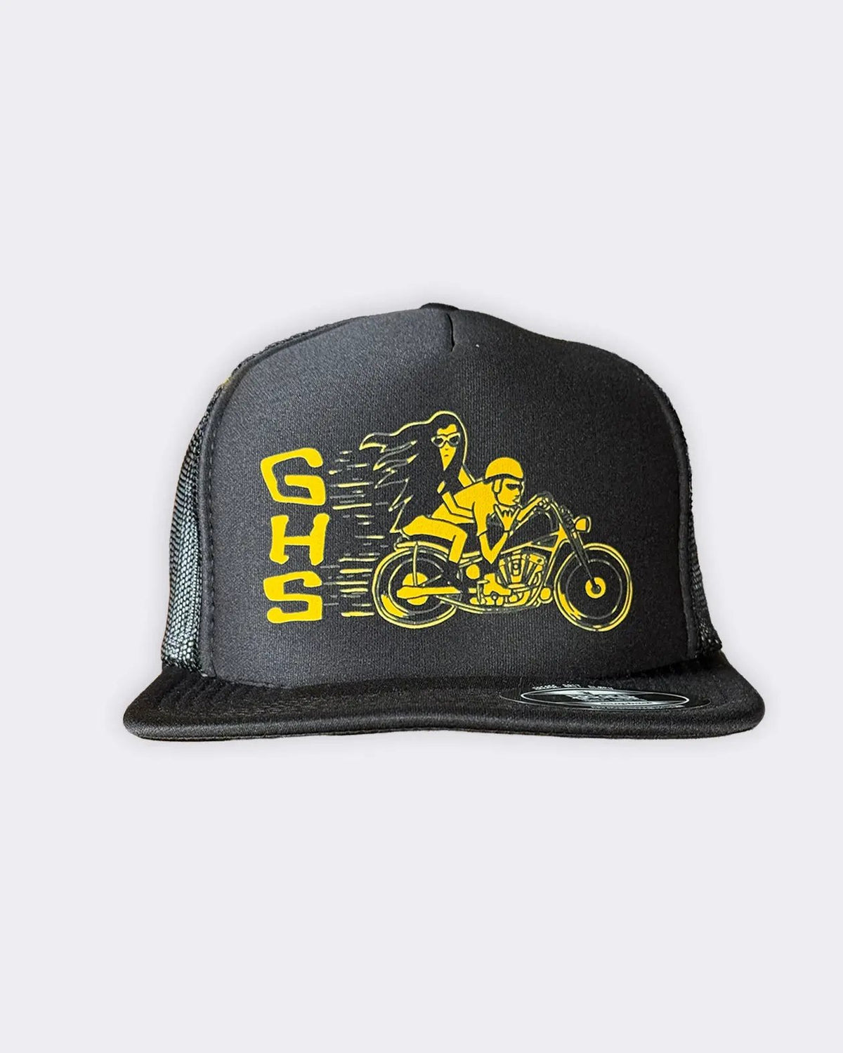 A black trucker hat with a yellow graphic of a woman riding a motorcycle next to the letters 'GHS', shown against a light gray background - Degenerates Hat by Greasy Hands Society