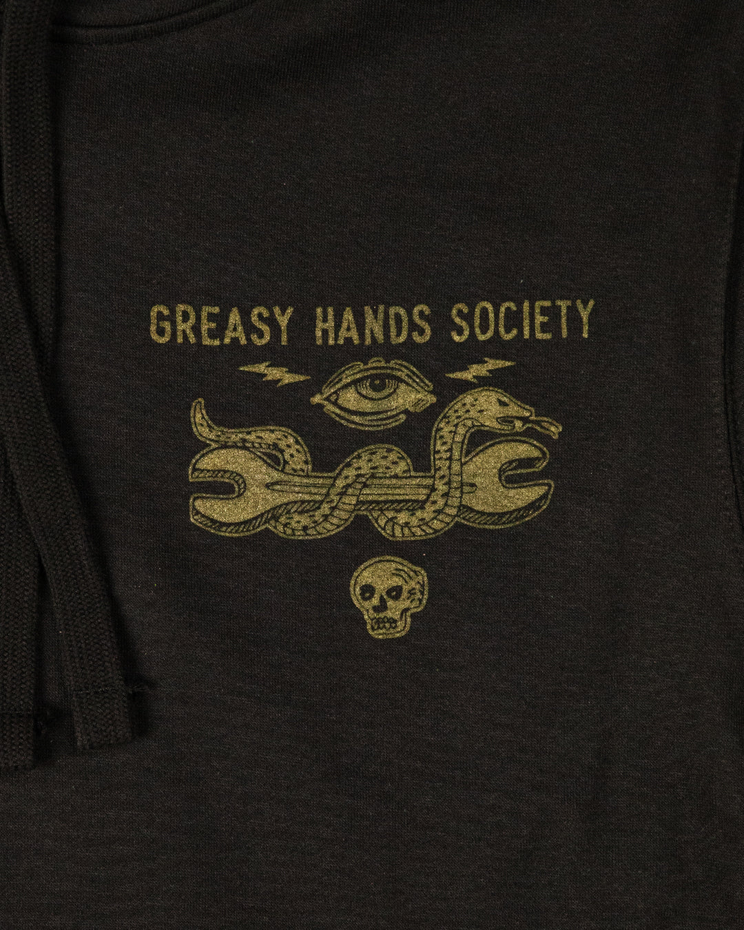 Black hoodie with 'Greasy Hands Society' text in gold with a snake holding a wrench on a dark background - Snake Eye Hoodie by Greasy Hands Society