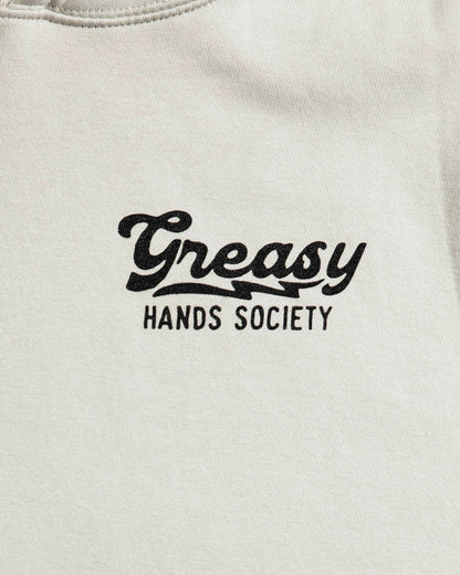 beige sweatshirt with 'Greasy Hands Society' text in black on a white background