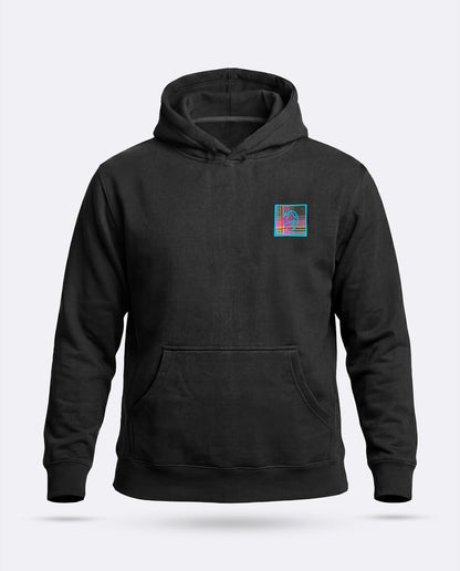 A black pullover hoodie with a small colorful geometric graphic on the left chest, displayed on a light gray background - the Blitzkreig Hoodie by Greasy Hands Society