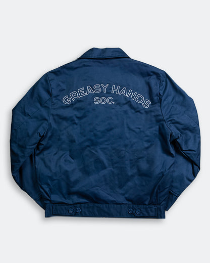 back graphic of Navy blue jacket with 'Greasy Hands Soc.' text on the back against a white background