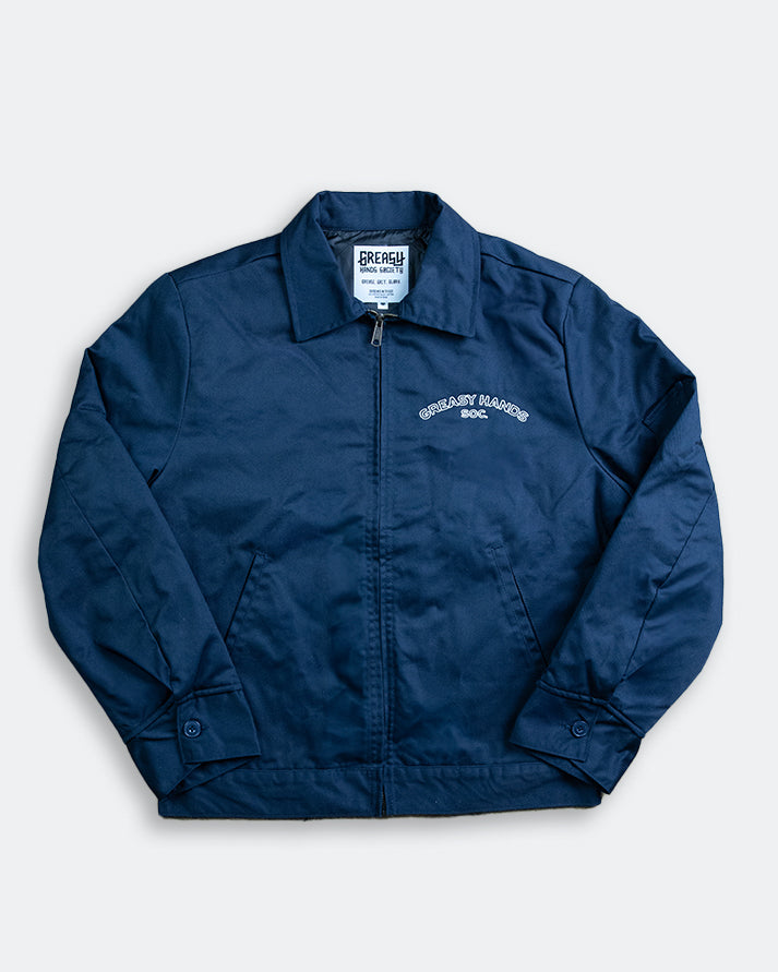 Navy Blue jacket with a brand label on a light gray background