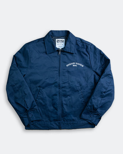 Navy Blue jacket with a brand label on a light gray background