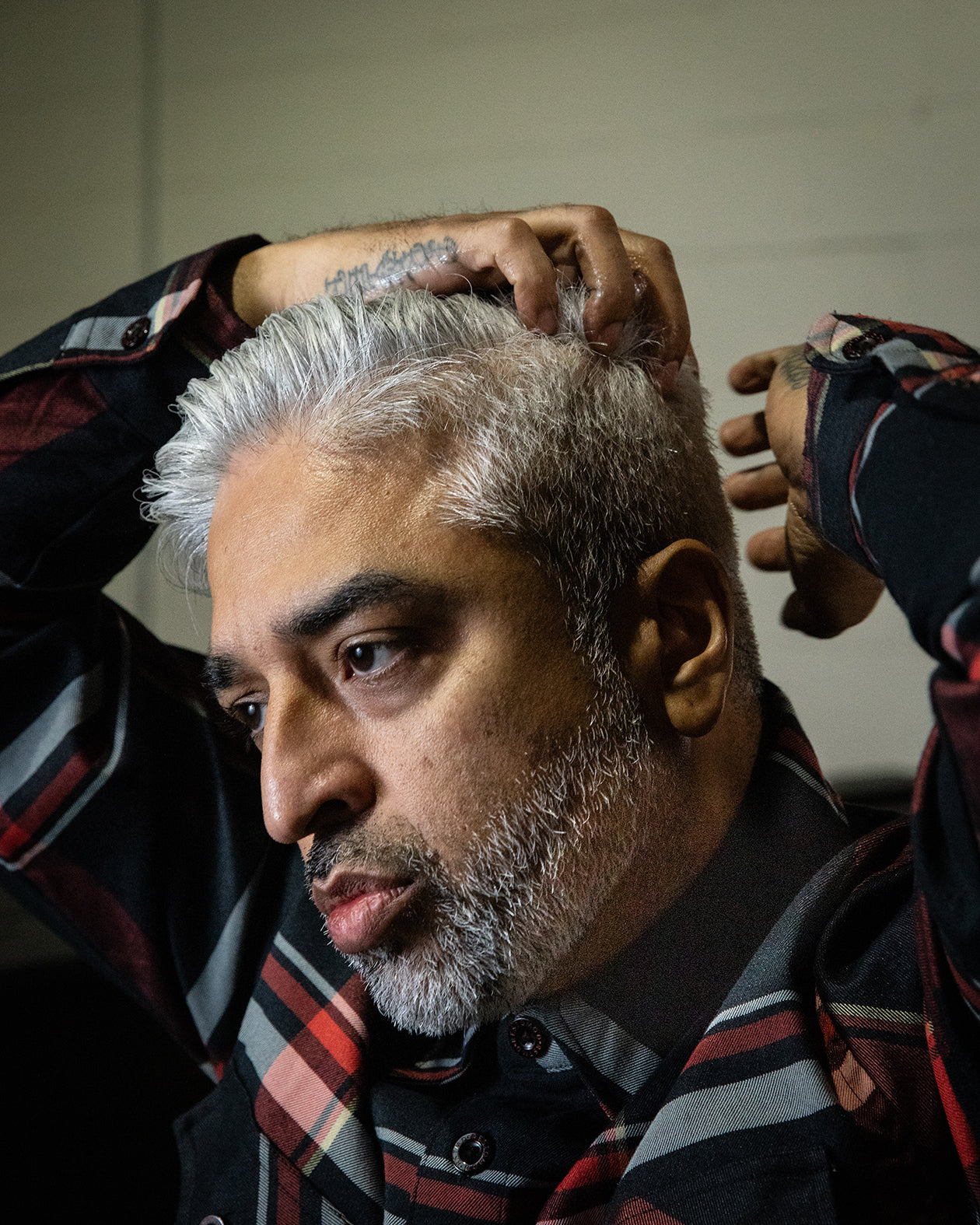 clay pomade model shot with dappa dan - psycho wrench grooming products oil and grit clay-based pomade for a textured look