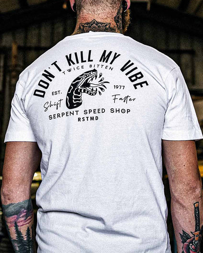Person wearing a white t-shirt with black text and graphics on the back, set against a blurred indoor background - Don't Kill my Vibe Men's white graphic tee by Greasy Hands Society