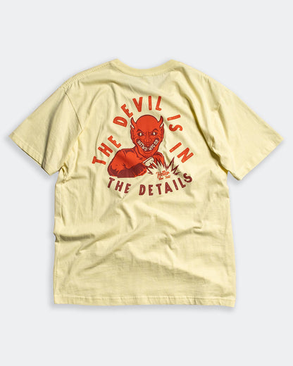 devil is in the details yellow tee shirt full back graphic of a devil graphic tee flat lay