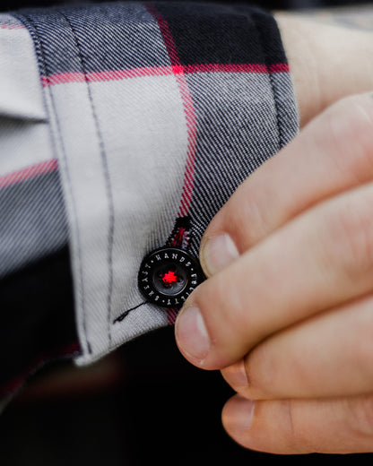 black red and gray flannel barrel cuff on the banger flannel showing greasy hands society button